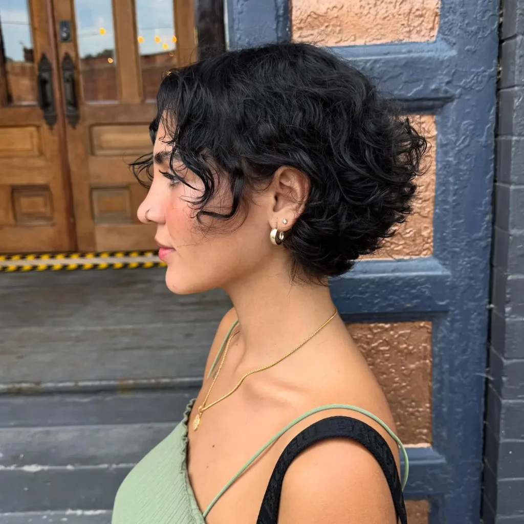 Black Curly Bixie with Pinned-Up Back and Loose Fringe Curls