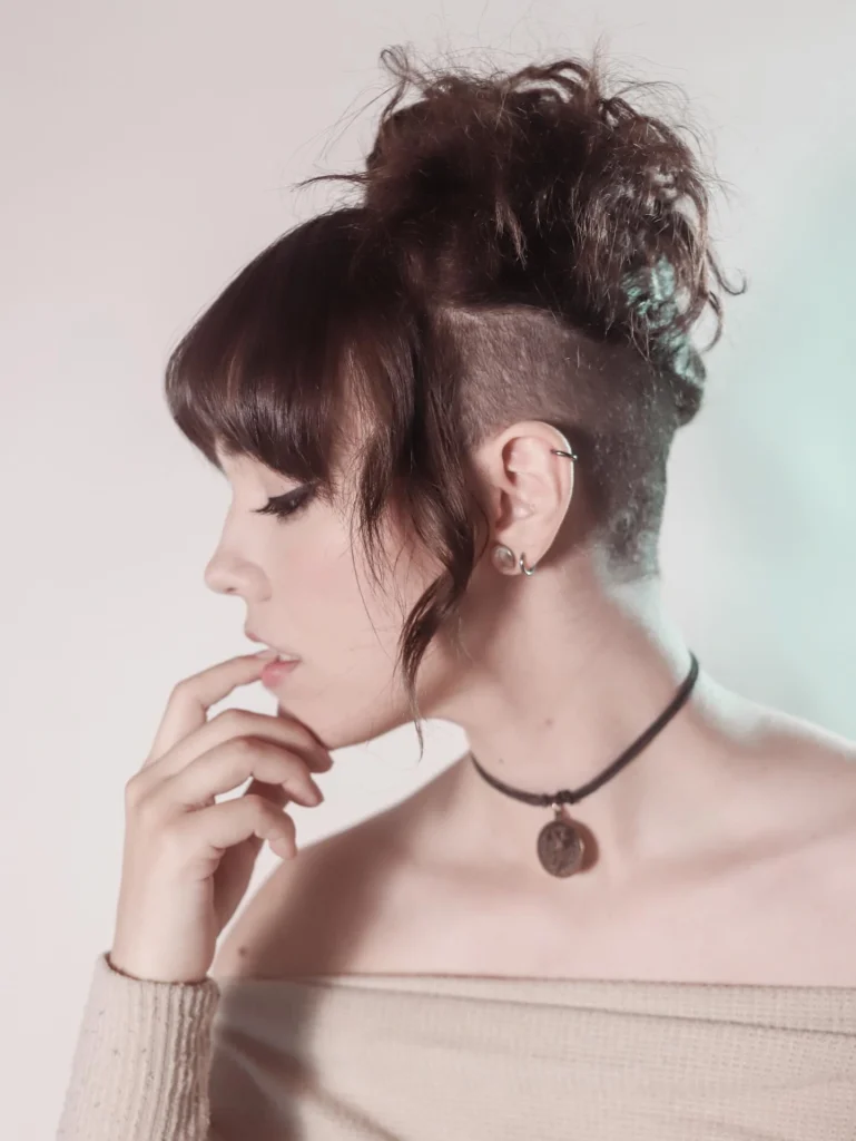 Edgy Undercut with Messy Updo and Blunt Bangs
