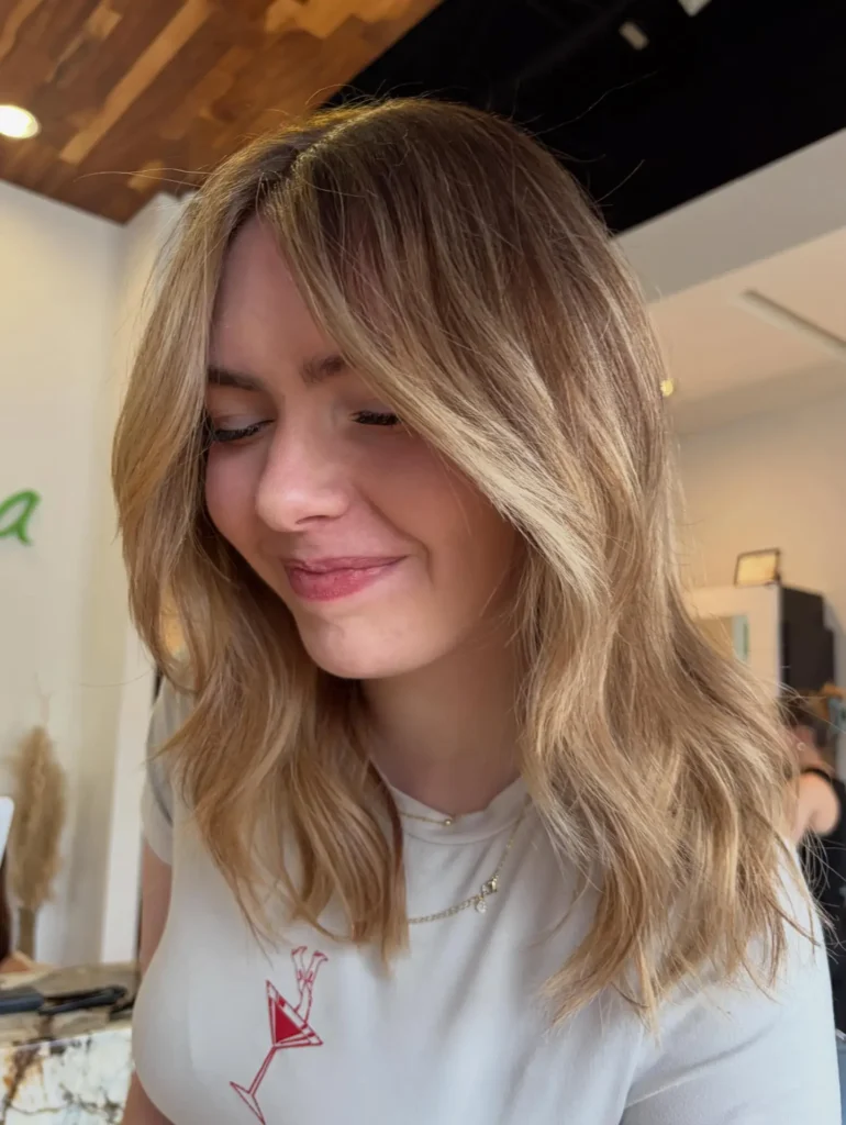 Honey Blonde Long Bixie with Curtain Bangs and Beach Waves