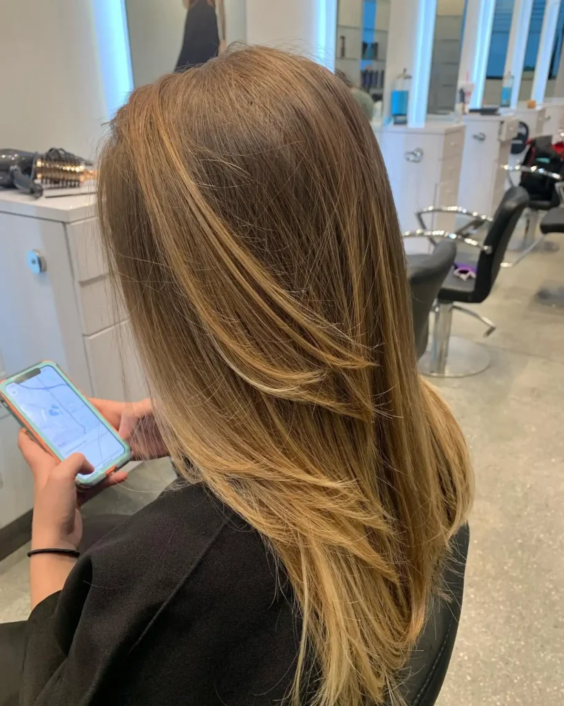  Honey Blonde Straight Layers with Diagonal Movement