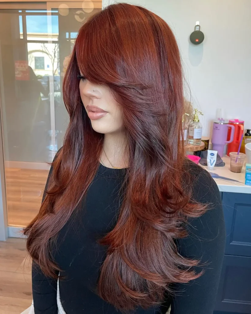 Rich Auburn Red Layered Cut with Side Swept Bangs