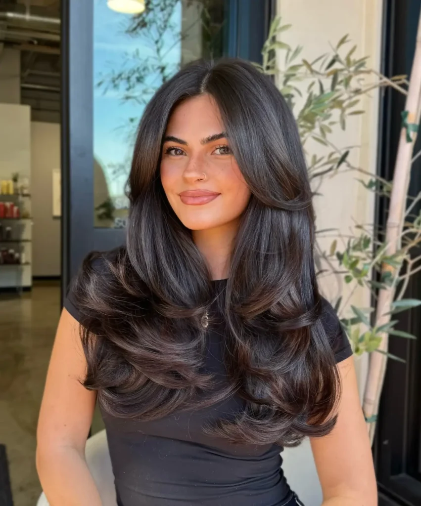 Voluminous Blow-Out Layers on Dark Hair
