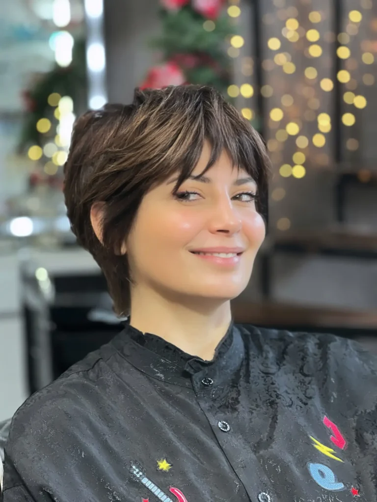 Warm Brown Layered Pixie with Soft Highlighted Fringe
