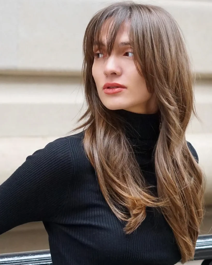Balayage Brunette With Long Layers and Textured Curtain Bangs