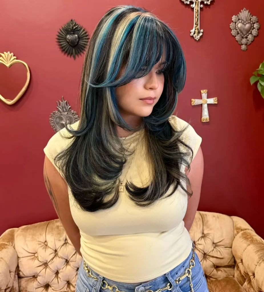 Black Hair With Bold Blonde and Teal Money Piece Curtain Bangs