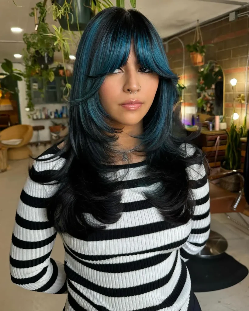 Black Hair With Teal Blue Curtain Bang Highlights and Layered Ends