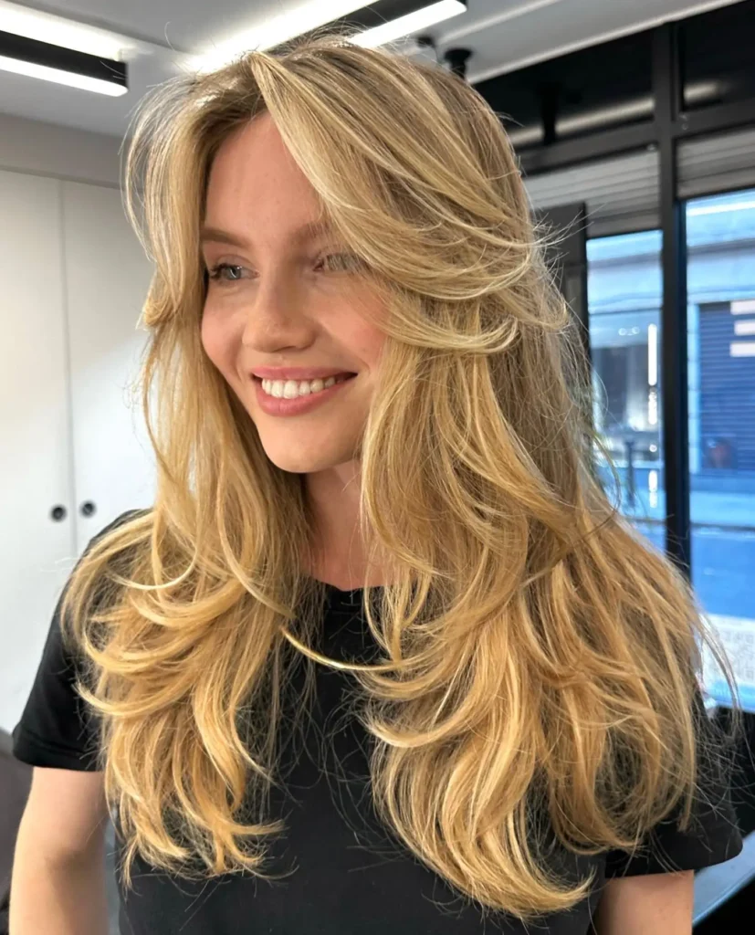 Buttery Blonde Long Layers With Breezy Curtain Bangs