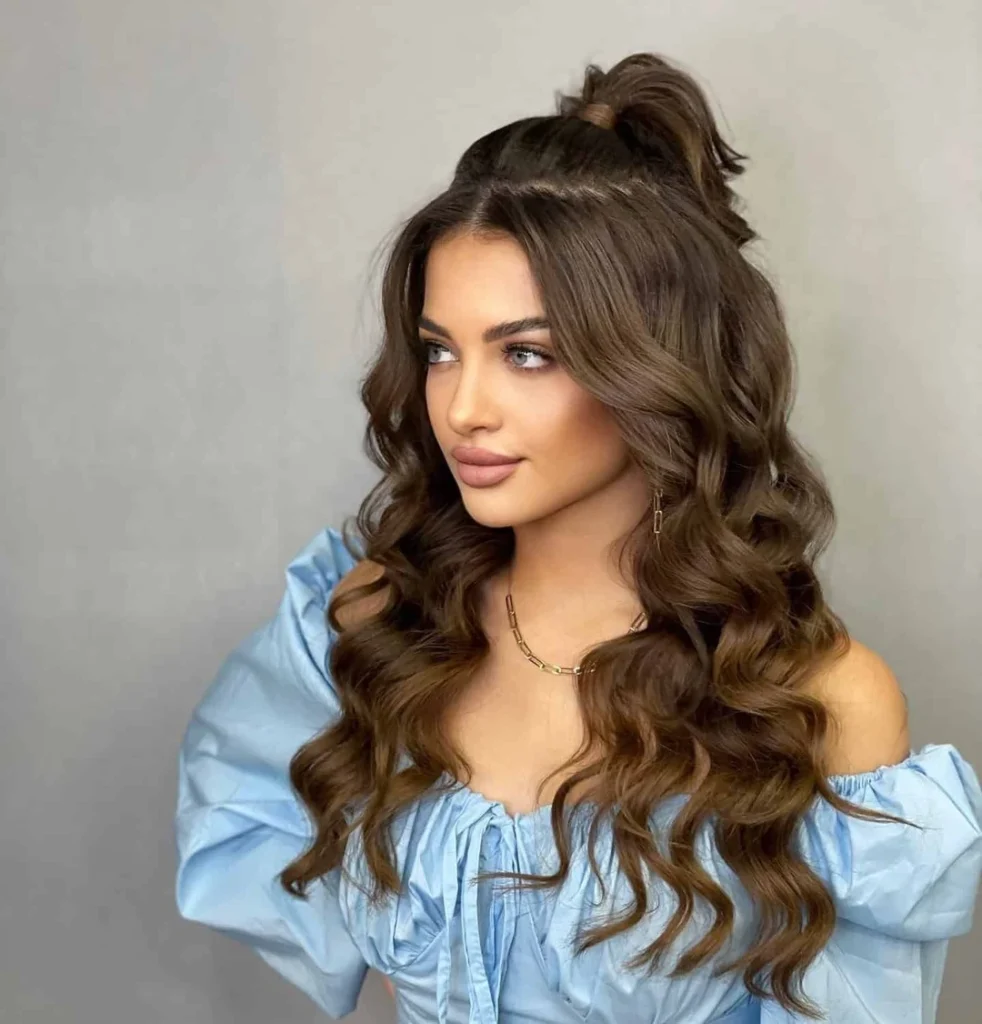 Half Up Top Knot with Voluminous Brunette Curls