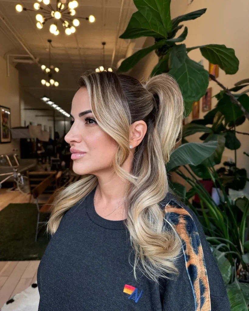 High Half Up Ponytail with Face-Framing Balayage Waves
