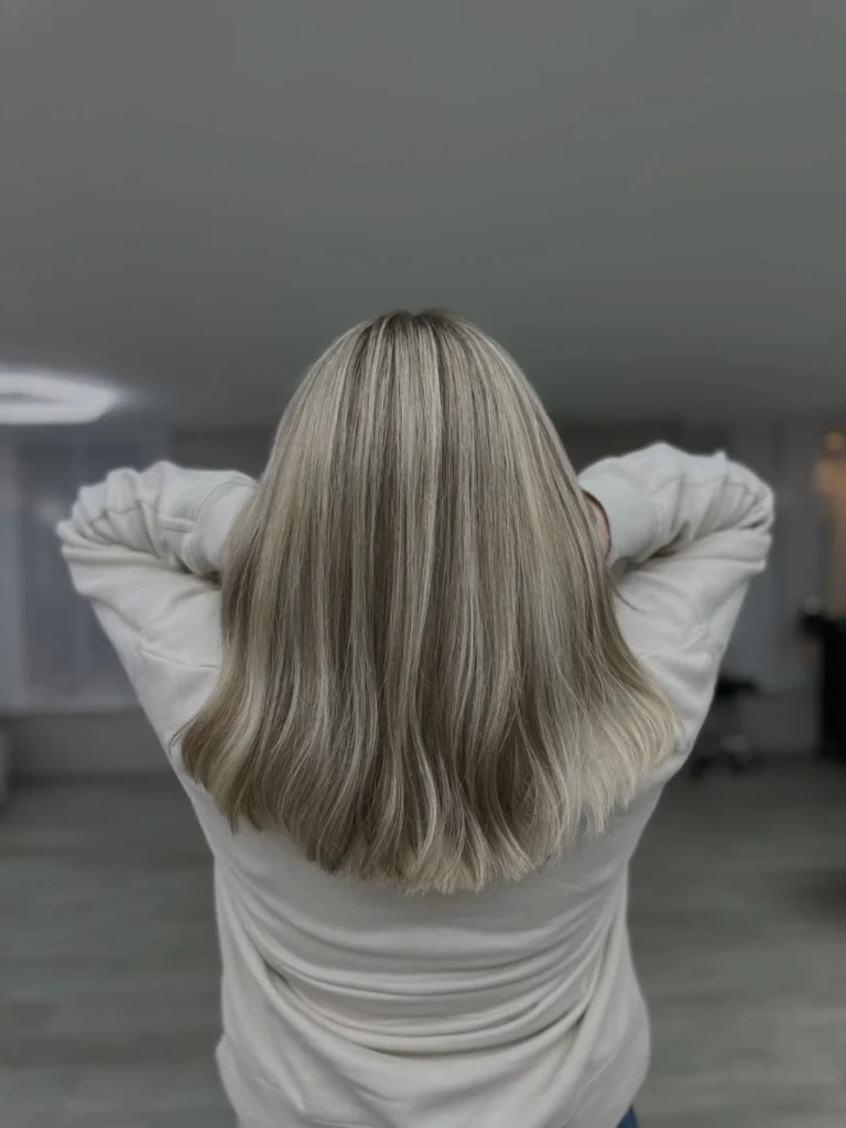 Icy Blonde Highlighted Lob with Dark Root Contrast