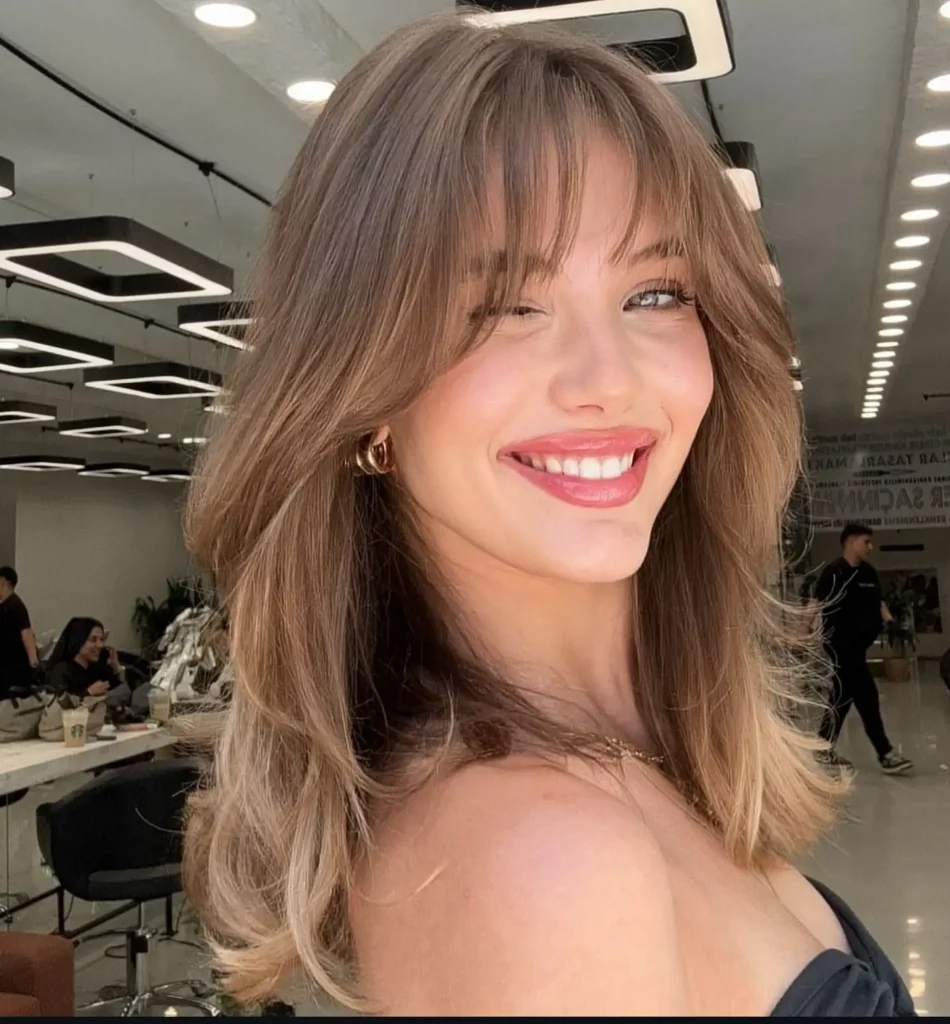 Light Brown Balayage Midi With Wispy Curtain Bangs