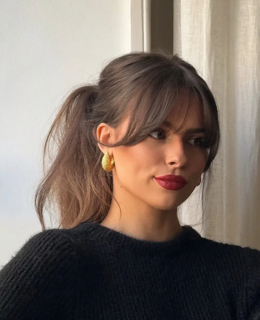 Messy Ponytail With Curtain Bangs