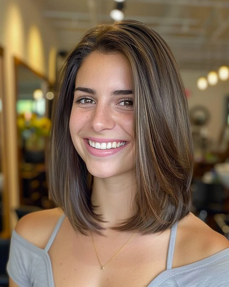 Sleek Dark Lob with Face-Framing Highlights