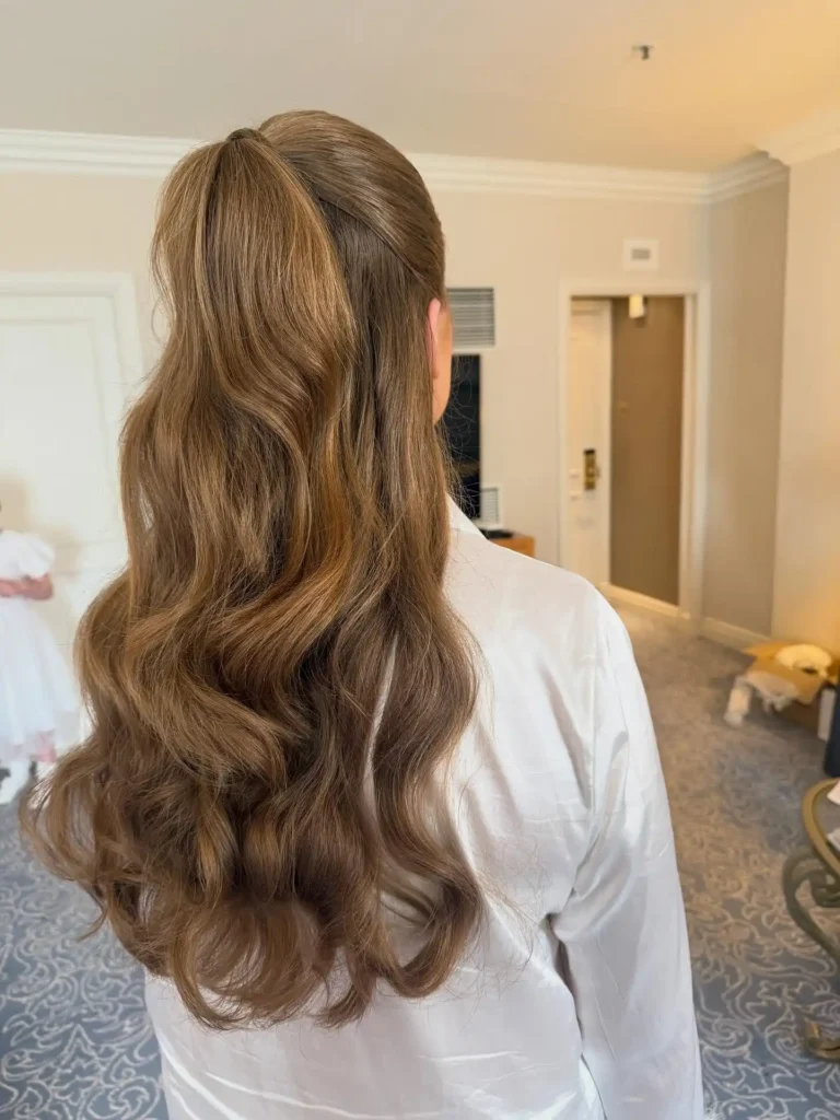 Sleek Half Up Ponytail with Soft Bridal Waves