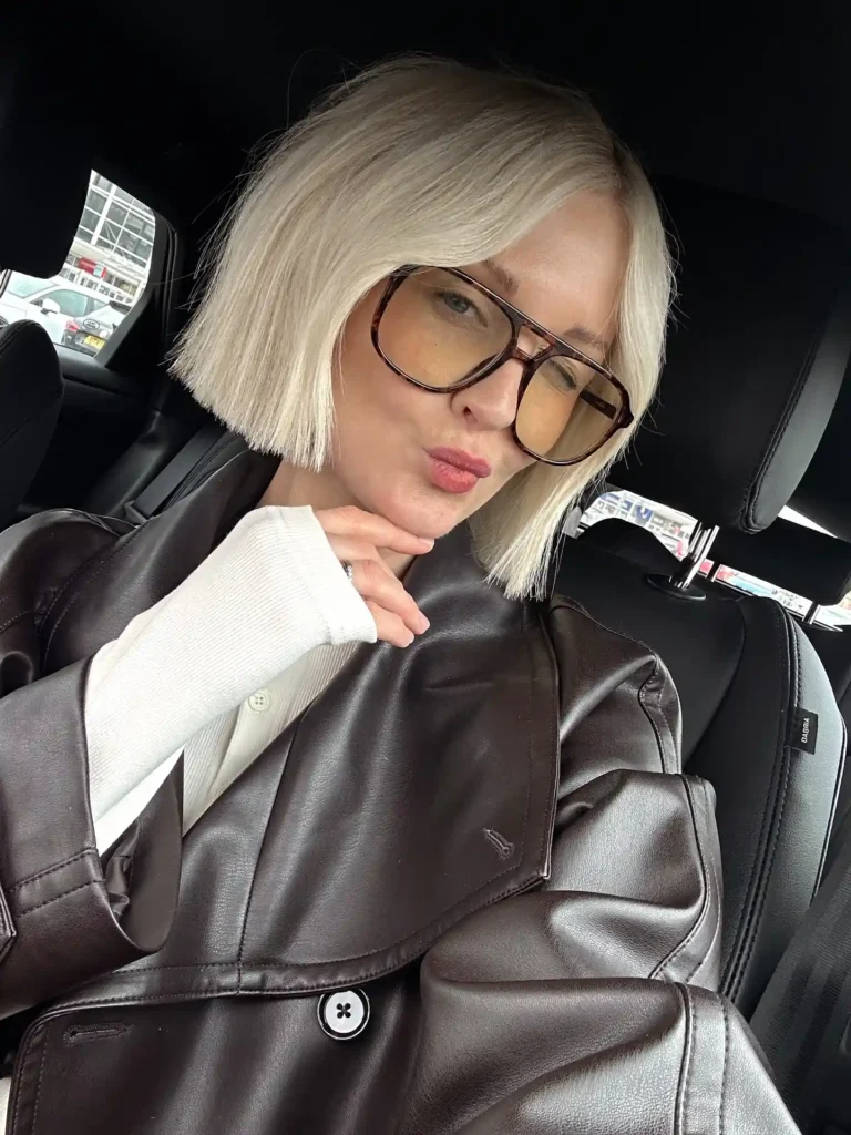  Sleek Platinum Blunt Bob with Clean Side Part and Poker-Straight Finish