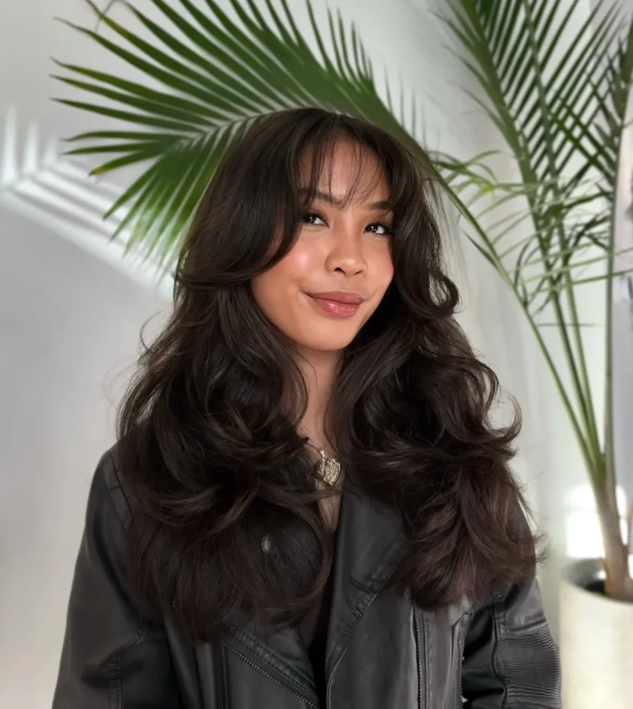 Soft Black Wavy Layers With Airy Curtain Bangs