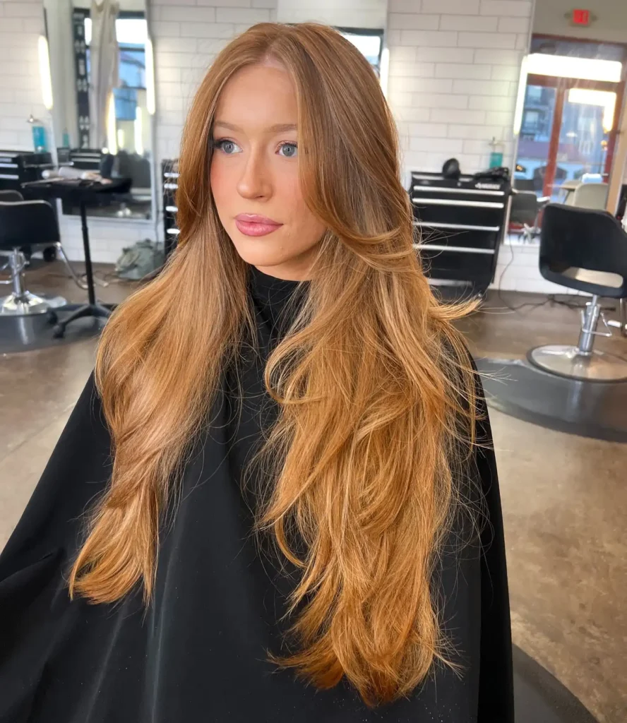 Strawberry Blonde Extra Long Layers With Soft Curtain Bangs
