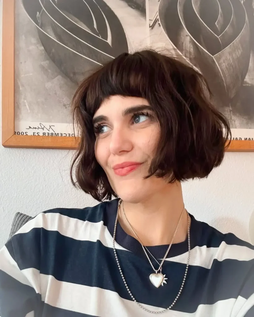 Vintage-Inspired Dark Bob with Blunt Mini Fringe and Wavy Ends