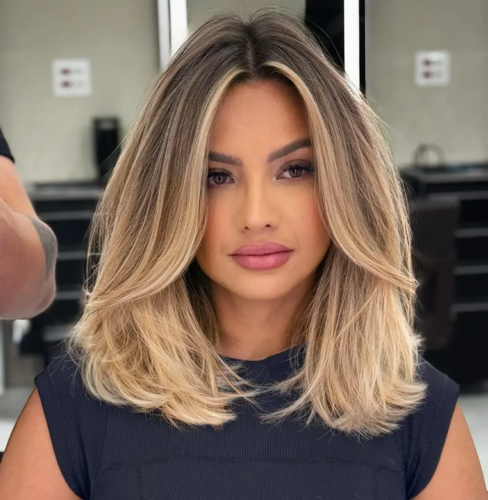 Voluminous Blonde Lob with Dark Root Melt
