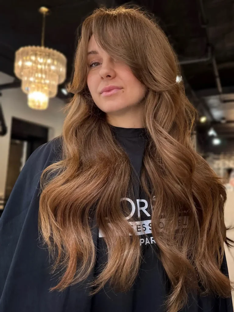 Warm Brunette Waves With Soft Curtain Bangs